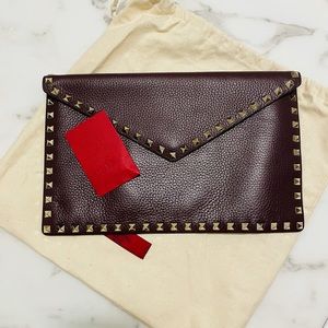 Valentino Garavani Rockstud clutch wine color